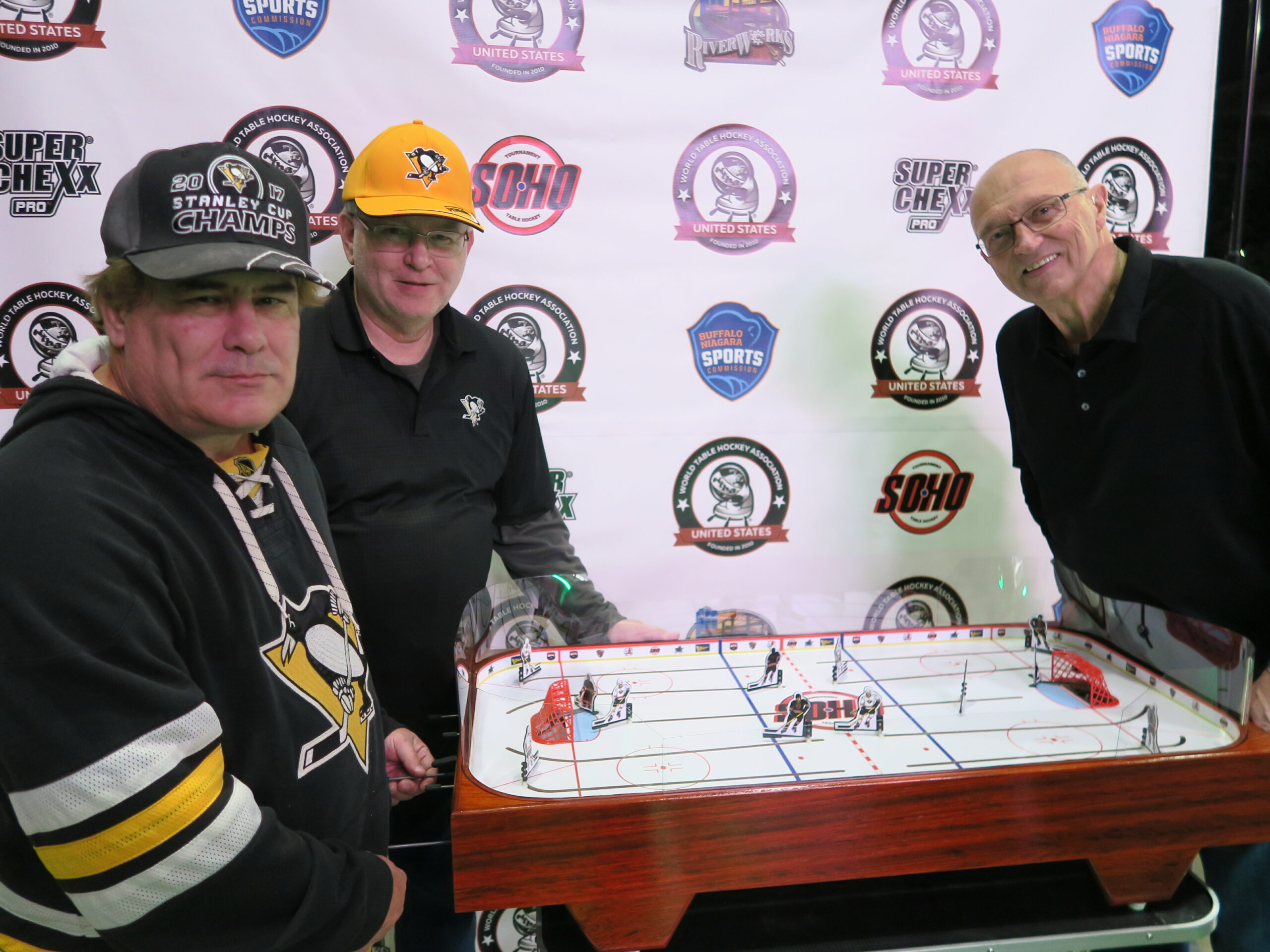NHL Alumnus, Don Luce, Buffalo Sabres playing SoHo Table Hockey against two fans from Pittsburgh